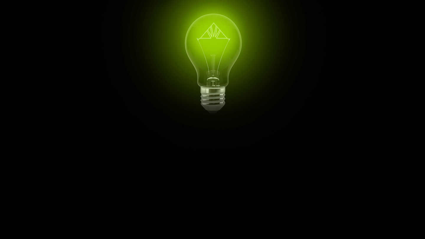 green lightbulb with Regions logo in the filament on a black background